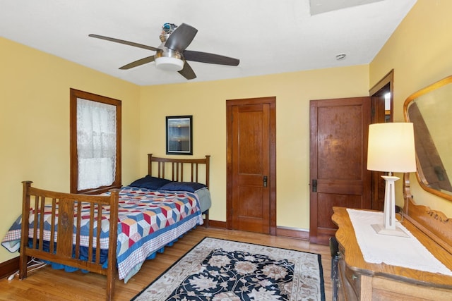 116 9th Ave NW, Rochester, MN 55901 - bedroom featuring light wood finished floors and a ceiling fan
