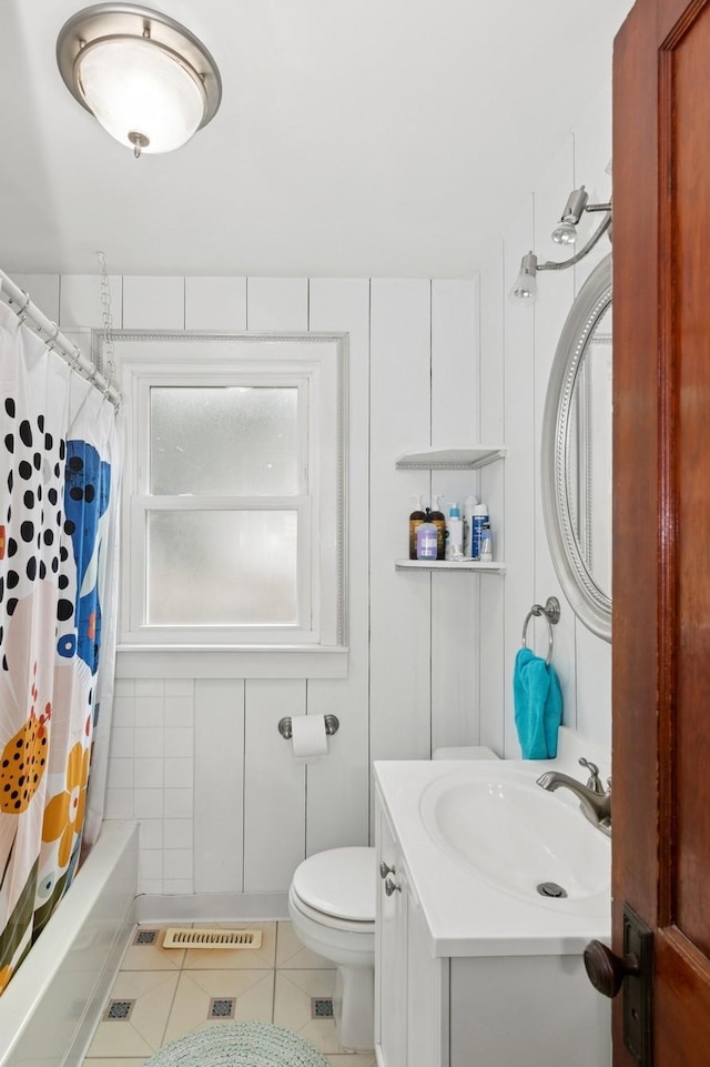 116 9th Ave NW, Rochester, MN 55901 - full bathroom with tile patterned floors, vanity, and shower / bathtub combination with curtain
