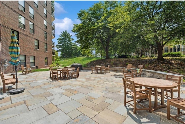 6615 Lake Shore Dr S Unit 317, Richfield, MN 55423 - view of patio with outdoor dining space and a grill