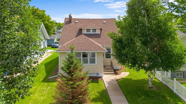 1634 Upton Ave N, Minneapolis, MN 55411 - view of front of home with a shingled roof and a chimney