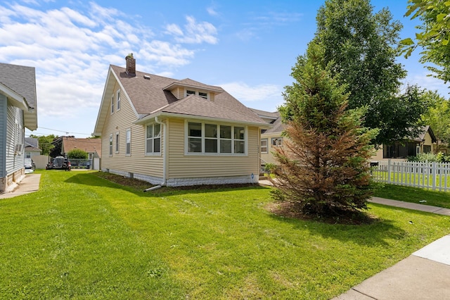 1634 Upton Ave N, Minneapolis, MN 55411 - view of side of home featuring a chimney and a shingled roof
