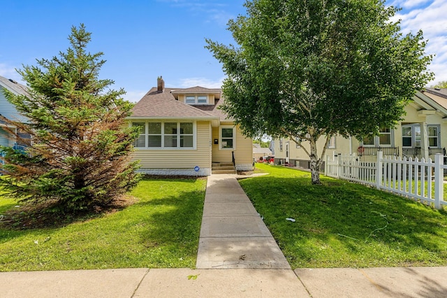 1634 Upton Ave N, Minneapolis, MN 55411 - view of front of home featuring a chimney and a shingled roof