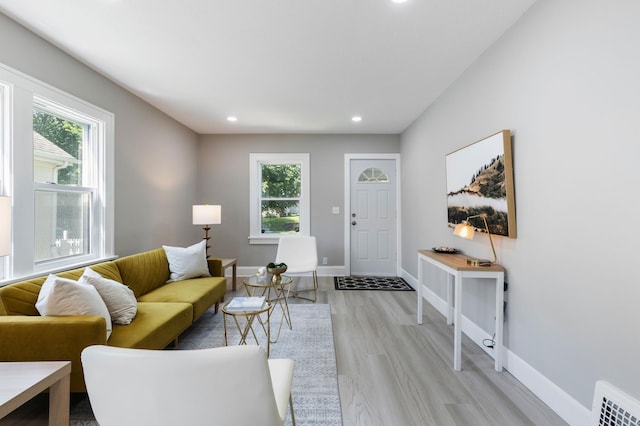 1634 Upton Ave N, Minneapolis, MN 55411 - living room with healthy amount of natural light, light wood-type flooring, and recessed lighting