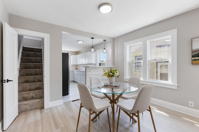 1634 Upton Ave N, Minneapolis, MN 55411 - dining space featuring stairway and light wood-type flooring