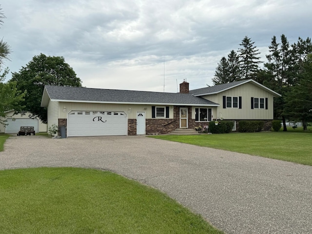 31044 Acorn Lake Rd, Frazee, MN 56544 - split level home with a garage, driveway, a chimney, and roof with shingles