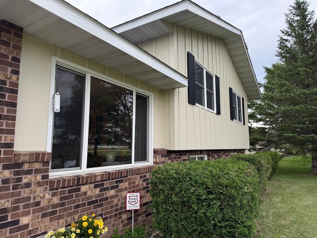 31044 Acorn Lake Rd, Frazee, MN 56544 - view of property exterior featuring brick siding and a yard