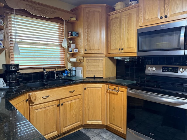 31044 Acorn Lake Rd, Frazee, MN 56544 - kitchen featuring appliances with stainless steel finishes, backsplash, dark stone countertops, light tile patterned floors, and open shelves