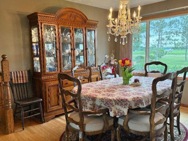 31044 Acorn Lake Rd, Frazee, MN 56544 - dining room with a chandelier and light wood-style floors