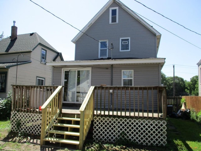 658 Bellows St, Saint Paul, MN 55107 - rear view of property with a wooden deck and stairs