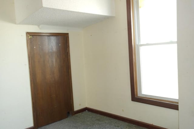 658 Bellows St, Saint Paul, MN 55107 - unfurnished room with plenty of natural light and carpet flooring