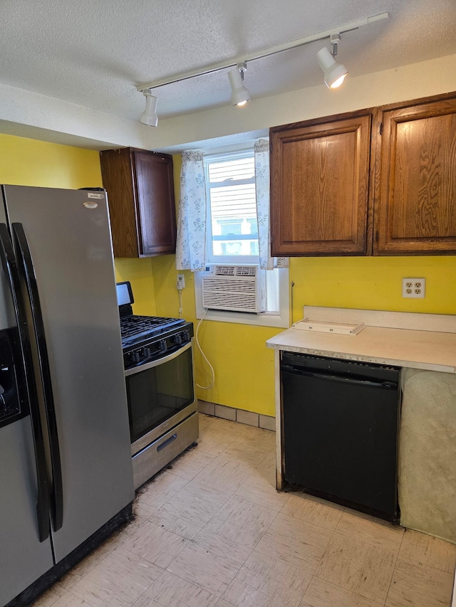 658 Bellows St, Saint Paul, MN 55107 - kitchen featuring appliances with stainless steel finishes, track lighting, cooling unit, light countertops, and light flooring