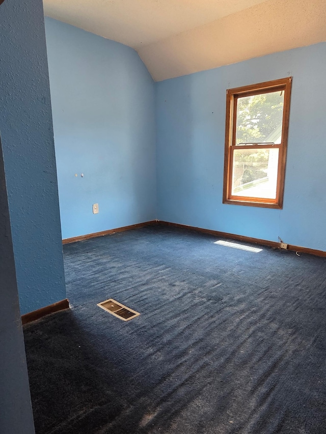 658 Bellows St, Saint Paul, MN 55107 - carpeted spare room with vaulted ceiling and baseboards