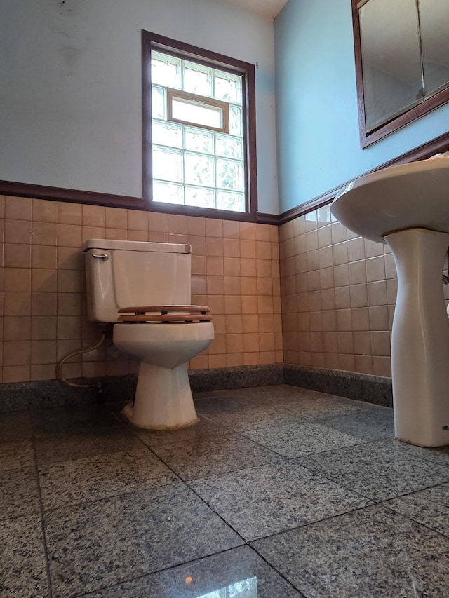 658 Bellows St, Saint Paul, MN 55107 - half bath with tile walls and wainscoting