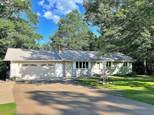 39631 342nd Ln, Aitkin, MN 56431 - single story home with an attached garage, driveway, a chimney, and a front yard