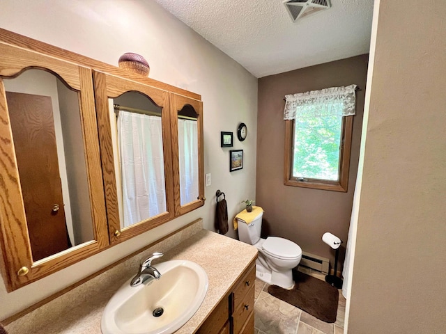 39631 342nd Ln, Aitkin, MN 56431 - full bath featuring vanity, a baseboard radiator, and a textured ceiling