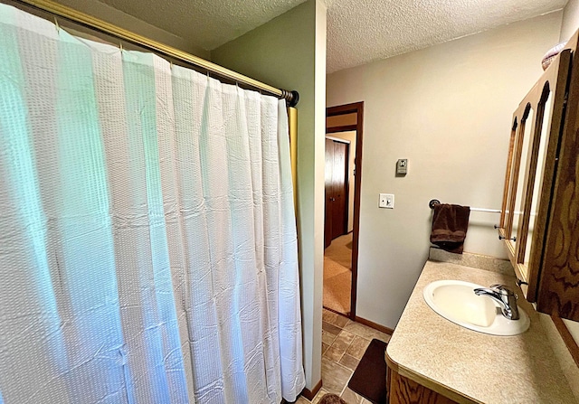 39631 342nd Ln, Aitkin, MN 56431 - bathroom with vanity, a textured ceiling, and a shower with curtain