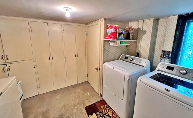 39631 342nd Ln, Aitkin, MN 56431 - washroom with washing machine and dryer, cabinet space, and wallpapered walls