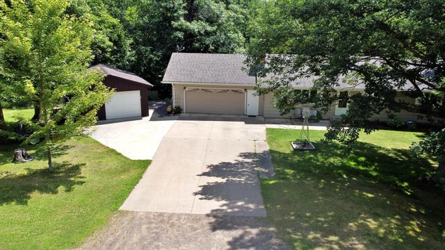 39631 342nd Ln, Aitkin, MN 56431 - view of front facade featuring a front yard, roof with shingles, and driveway