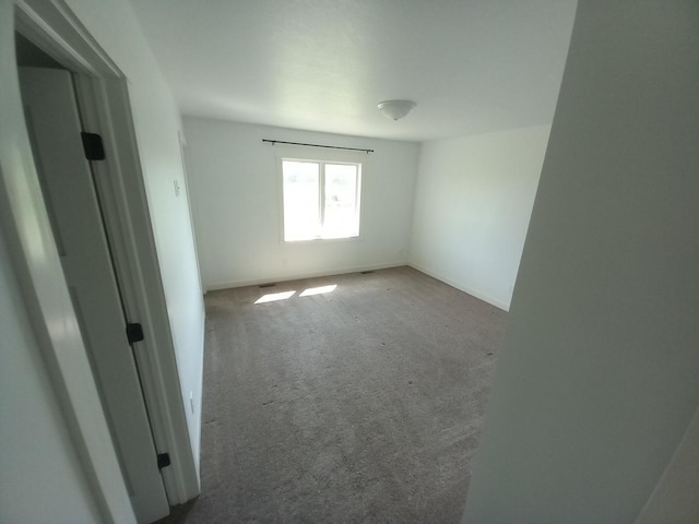 1267 146th Ave, New Richmond, WI 54017 - unfurnished room with carpet flooring and baseboards