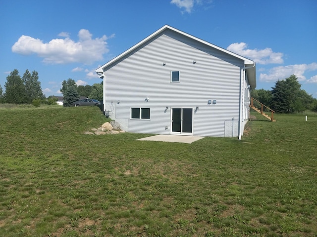 1267 146th Ave, New Richmond, WI 54017 - back of property featuring a patio area and a lawn