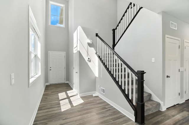 6450 Inspire Cir S, Cottage Grove, MN 55016 - foyer with a high ceiling, stairway, and wood finished floors