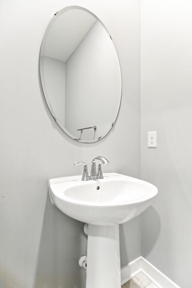 6450 Inspire Cir S, Cottage Grove, MN 55016 - bathroom featuring baseboards and a sink