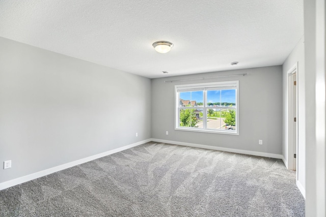 6450 Inspire Cir S, Cottage Grove, MN 55016 - carpeted spare room featuring baseboards and a textured ceiling