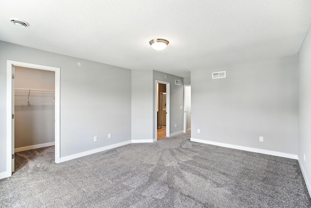 6450 Inspire Cir S, Cottage Grove, MN 55016 - unfurnished bedroom with carpet floors and a spacious closet