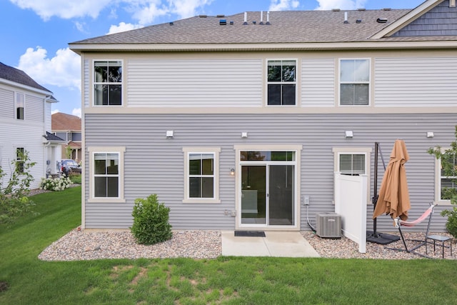 6450 Inspire Cir S, Cottage Grove, MN 55016 - rear view of property featuring a yard, a patio area, and a shingled roof
