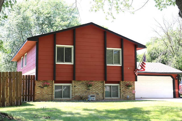 8301 Sumter Ave N, Brooklyn Park, MN 55445 - view of front of home with a garage, brick siding, and concrete driveway