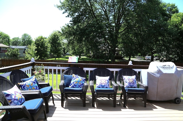 8301 Sumter Ave N, Brooklyn Park, MN 55445 - wooden deck with an outdoor hangout area and grilling area
