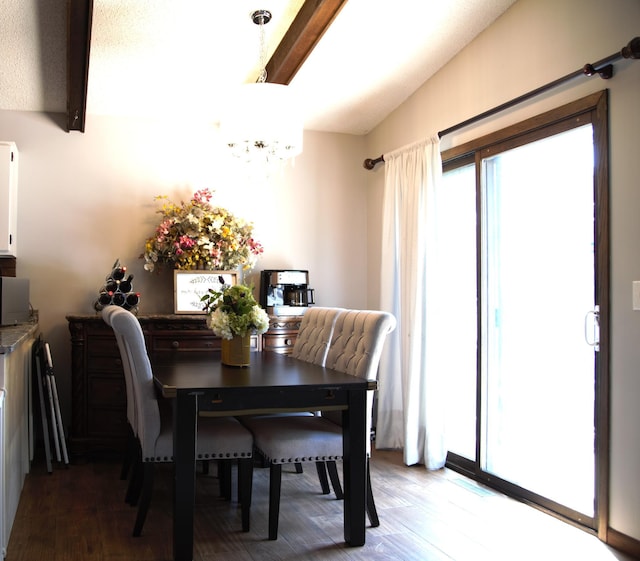 8301 Sumter Ave N, Brooklyn Park, MN 55445 - dining area with wood finished floors and a chandelier