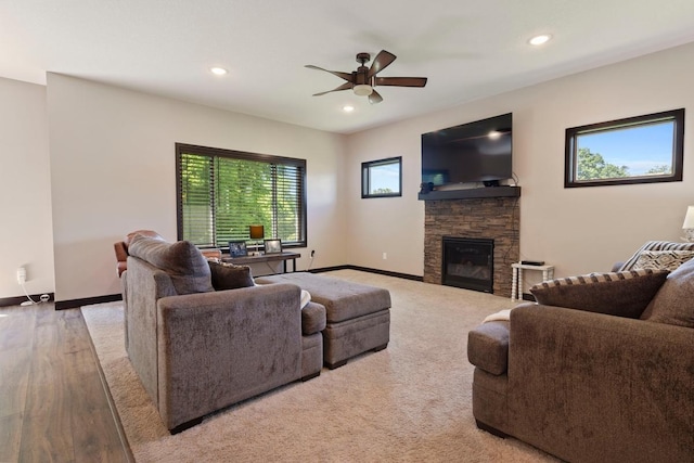 2065 Pleasant Dr, Prescott, WI 54021 - living room with a ceiling fan, a stone fireplace, recessed lighting, and wood finished floors