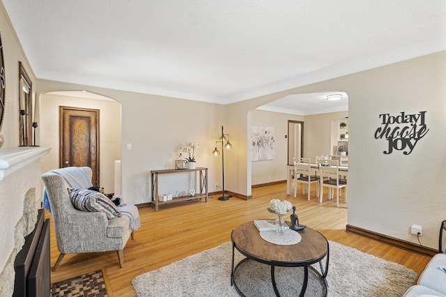 5321 Park Ave, Minneapolis, MN 55417 - living area with arched walkways and light wood-style flooring
