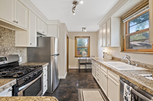 5321 Park Ave, Minneapolis, MN 55417 - kitchen featuring stainless steel appliances, white cabinetry, and decorative backsplash