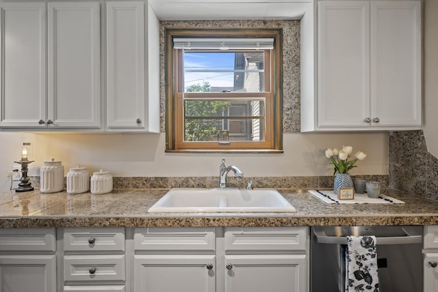 5321 Park Ave, Minneapolis, MN 55417 - kitchen with stainless steel dishwasher, tile countertops, and white cabinets