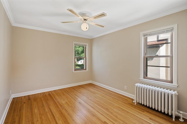 5321 Park Ave, Minneapolis, MN 55417 - unfurnished room featuring radiator heating unit, light wood-type flooring, ornamental molding, and a ceiling fan
