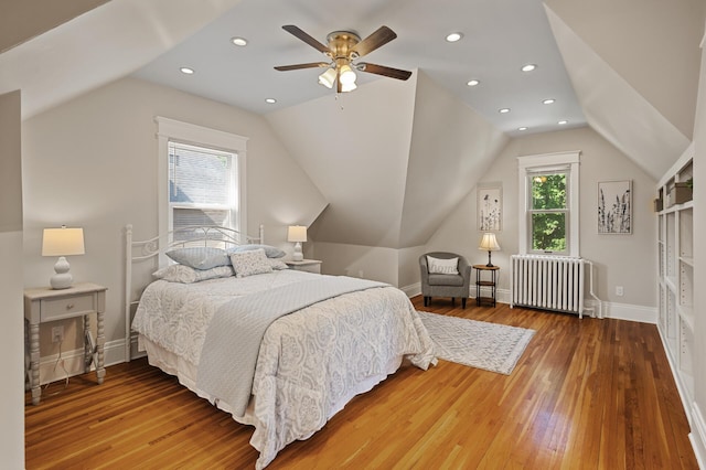 5321 Park Ave, Minneapolis, MN 55417 - bedroom with radiator, lofted ceiling, hardwood / wood-style floors, ceiling fan, and recessed lighting