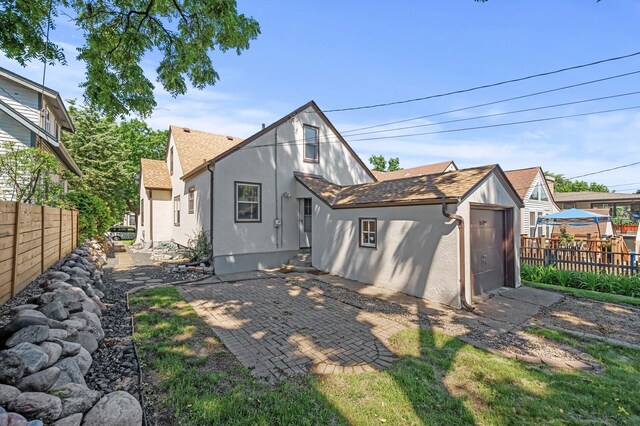5321 Park Ave, Minneapolis, MN 55417 - back of property with stucco siding and a patio