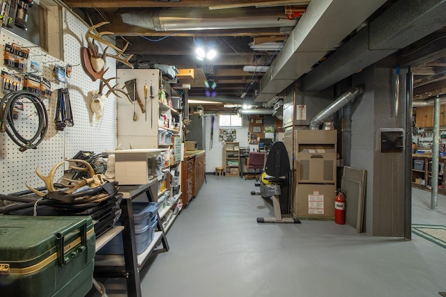 6770 County Road 65 NE, Deer River, MN 56636 - below grade area featuring a workshop area and heating unit