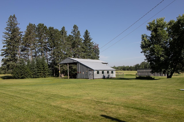 6770 County Road 65 NE, Deer River, MN 56636 - view of grassy yard with a pole building and an outbuilding