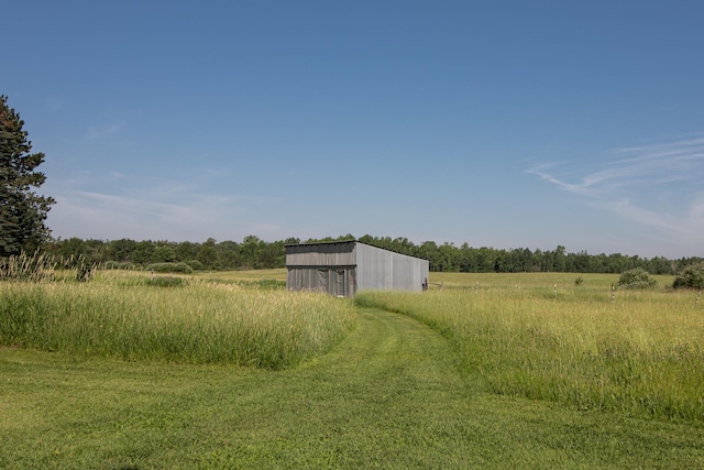 6770 County Road 65 NE, Deer River, MN 56636 - view of yard with a view of countryside, an outbuilding, and a pole building