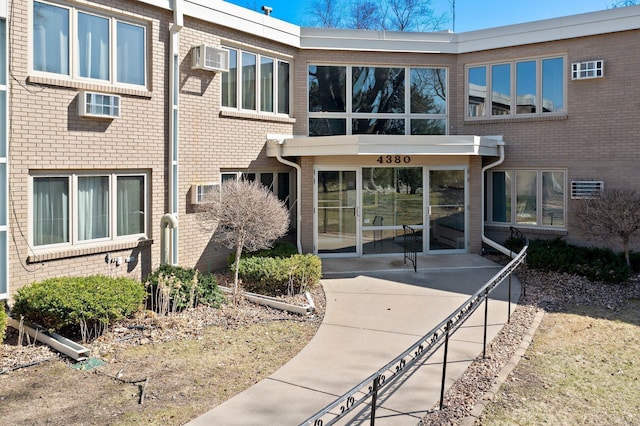 4380 Brookside Ct Unit 103, Edina, MN 55436 - view of front of property with brick siding and a wall mounted AC