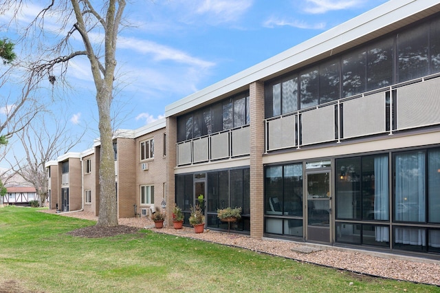 4380 Brookside Ct Unit 103, Edina, MN 55436 - rear view of house featuring brick siding and a lawn