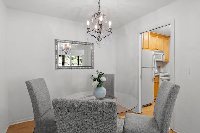 4380 Brookside Ct Unit 103, Edina, MN 55436 - dining room featuring a chandelier and light wood-style floors
