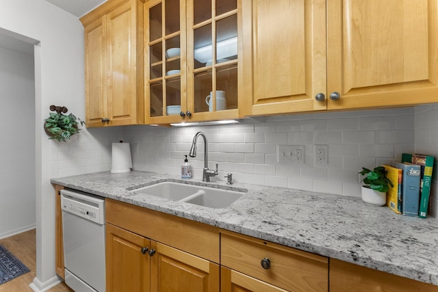 4380 Brookside Ct Unit 103, Edina, MN 55436 - kitchen featuring white dishwasher, backsplash, light stone counters, glass insert cabinets, and light wood-style flooring