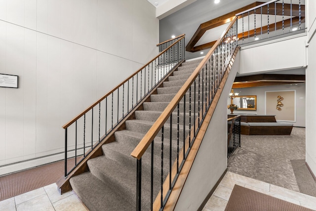 4380 Brookside Ct Unit 103, Edina, MN 55436 - staircase featuring tile patterned flooring, a high ceiling, a chandelier, and recessed lighting