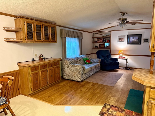 14 Silvers Resort, Elysian, MN 56028 - living room featuring ornamental molding, a ceiling fan, light wood-style floors, a textured ceiling, and wainscoting