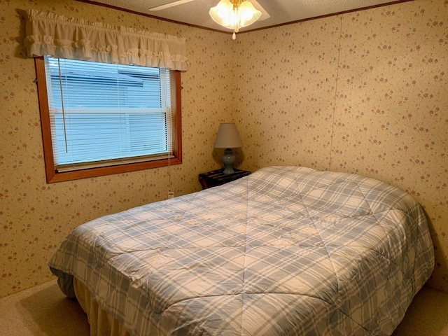 14 Silvers Resort, Elysian, MN 56028 - carpeted bedroom with wallpapered walls, crown molding, and ceiling fan