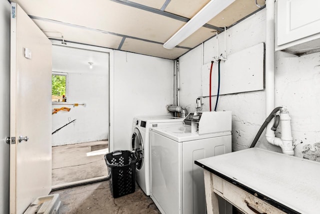 702 11th St, Duluth, MN 55805 - laundry area with separate washer and dryer and cabinet space